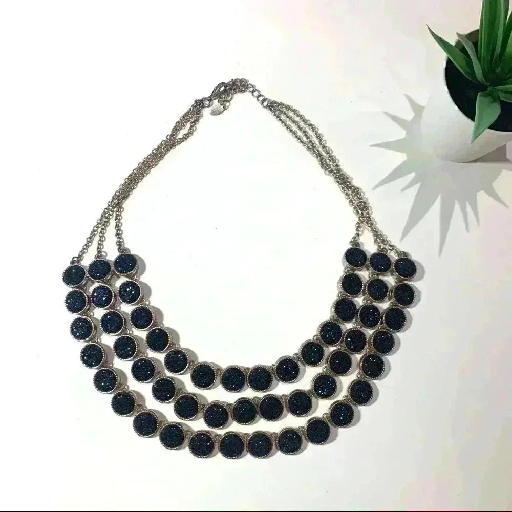 Gold statement necklace with black sparkly stones